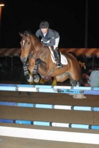 Ashlee Bond pilots the bay mare Wistful over a veritcal jump.