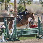 Jenny Karazissis and Undeniable clear a hunter geen jump.